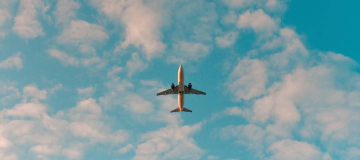 underbelly photo of an airplane flying overhead